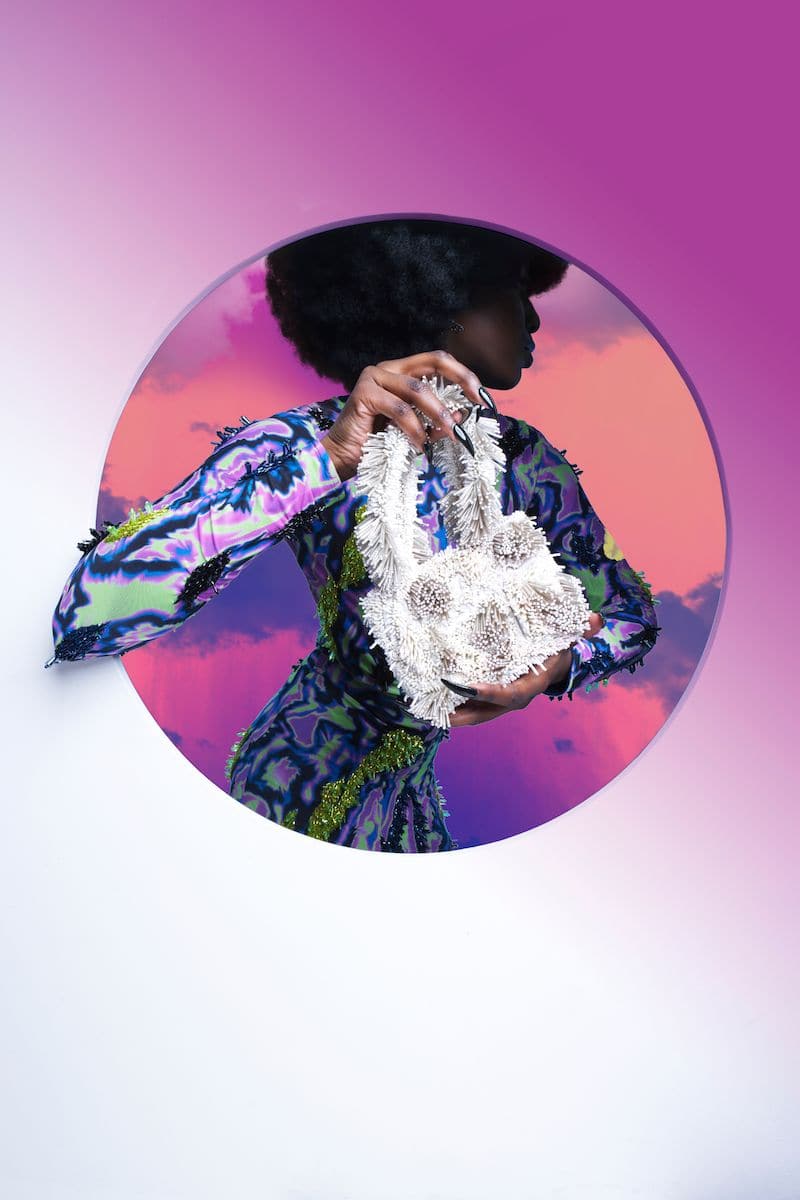 Onalaja ZAZA MINI white top handle bag with sleek design and compact size, featuring a stylish handle and smooth leather finish.
