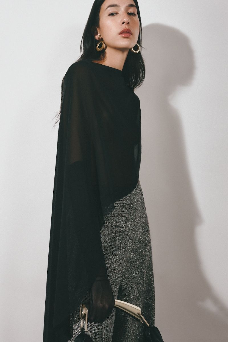 Gray tweed straight pants by Lecia with a tailored fit, shown on a model highlighting the fabric texture and classic style.