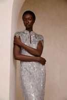 Elegant Raishma Amelia Gown featuring intricate lace detailing and a flowing silhouette, perfect for formal occasions.