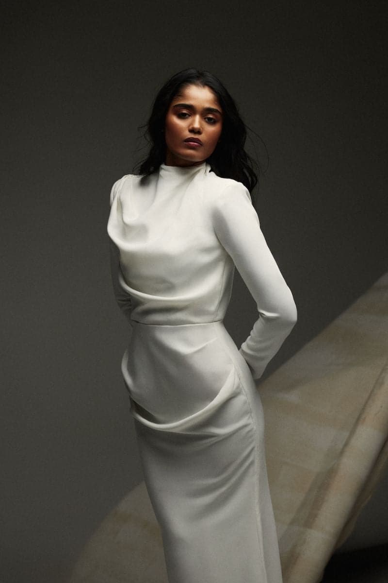 Deme by Gabriella CULT MIA X DEME maxi dress featuring a flowing fabric and elegant design, shown on a model.