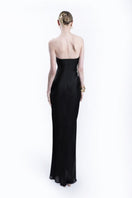 LEDIEL Kaya black gown with elegant long sleeves and a flowing design, perfect for formal occasions.