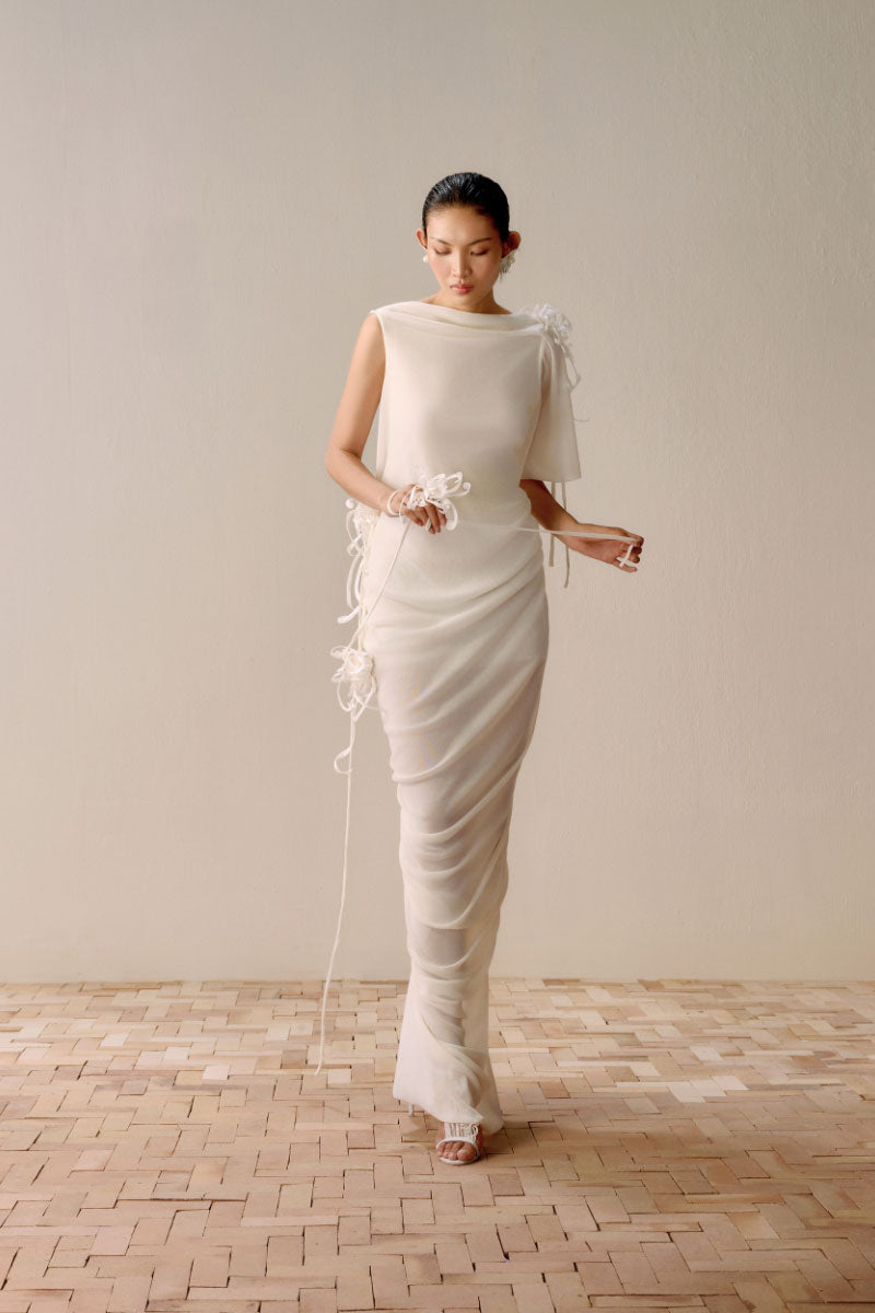 Lecia draped backless sheer white maxi dress with flowing fabric and elegant design, perfect for formal or evening wear.