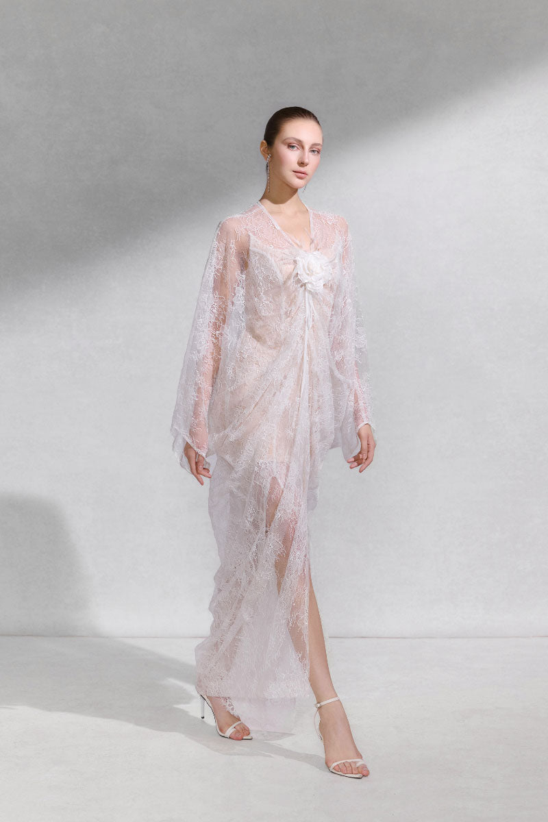 Arti Apparel Aura Dress, a stylish midi dress with flowing fabric, showcased on a model against a neutral background.
