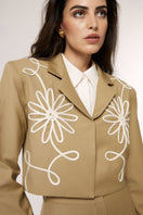 Beige Señorita Lara blazer jacket with tailored fit and classic lapel, displayed on a hanger.