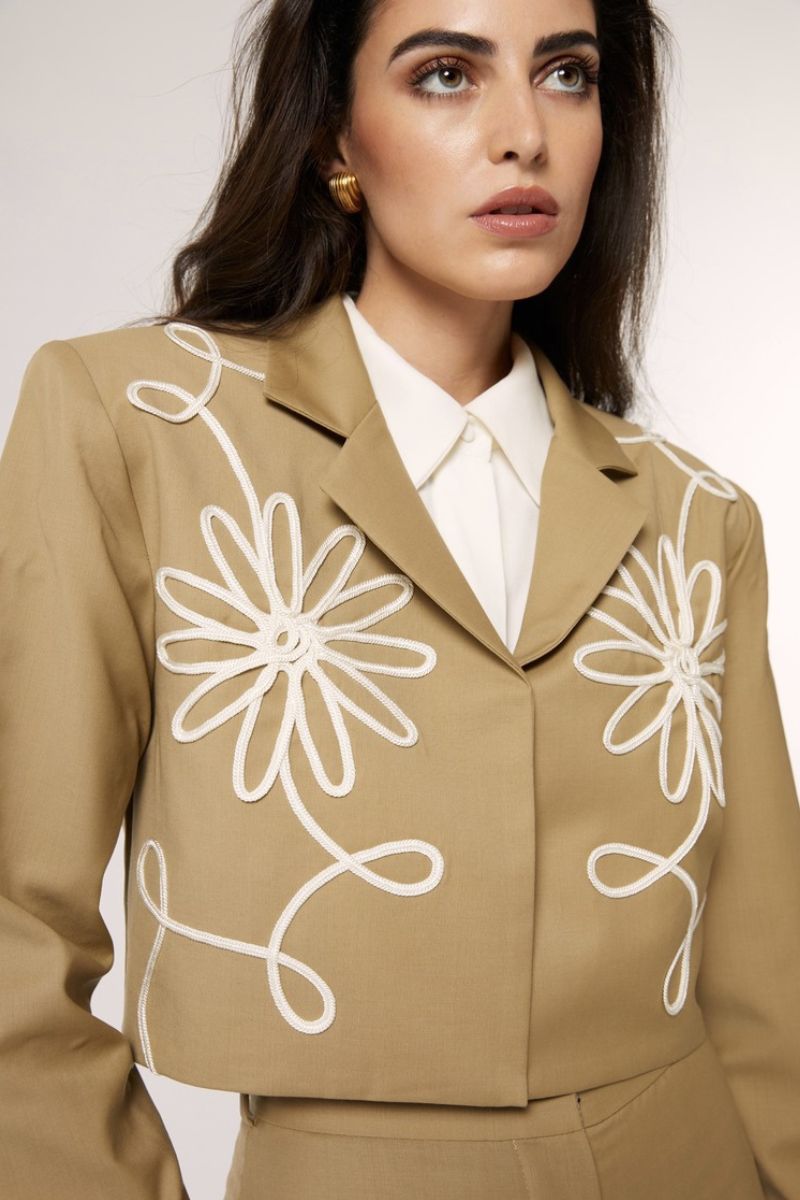 Beige Señorita Lara blazer jacket with tailored fit and classic lapel, displayed on a hanger.