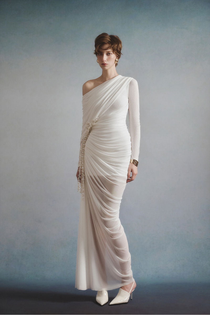 White Plan Selene draped maxi dress displayed on a hanger with flowing fabric and elegant style.