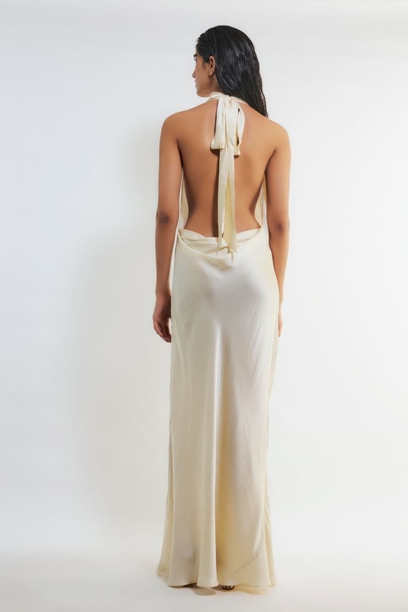 Off-white satin gown with high neckline by Deme By Gabriella, featuring a flowing, elegant design perfect for formal occasions.