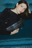 Vikele Studio opera clutch in python with sleek design and textured python pattern, featuring a compact, elegant style.
