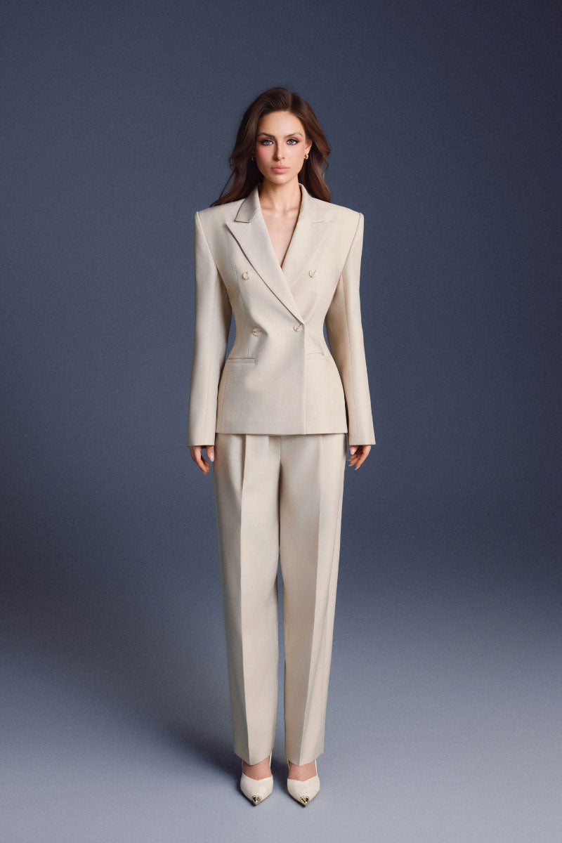Keira Tong lined pants in neutral fabric, showcasing slim fit design and waistband detail on a model.