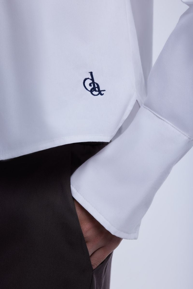 Cropped cotton button-down shirt by Dāl the Label, featuring a relaxed fit, classic collar, and long sleeves in a soft fabric.