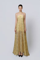 GILDED BLOOM maxi dress by TONYY featuring a floral pattern, flowing fabric, and elegant design for stylish summer wear.