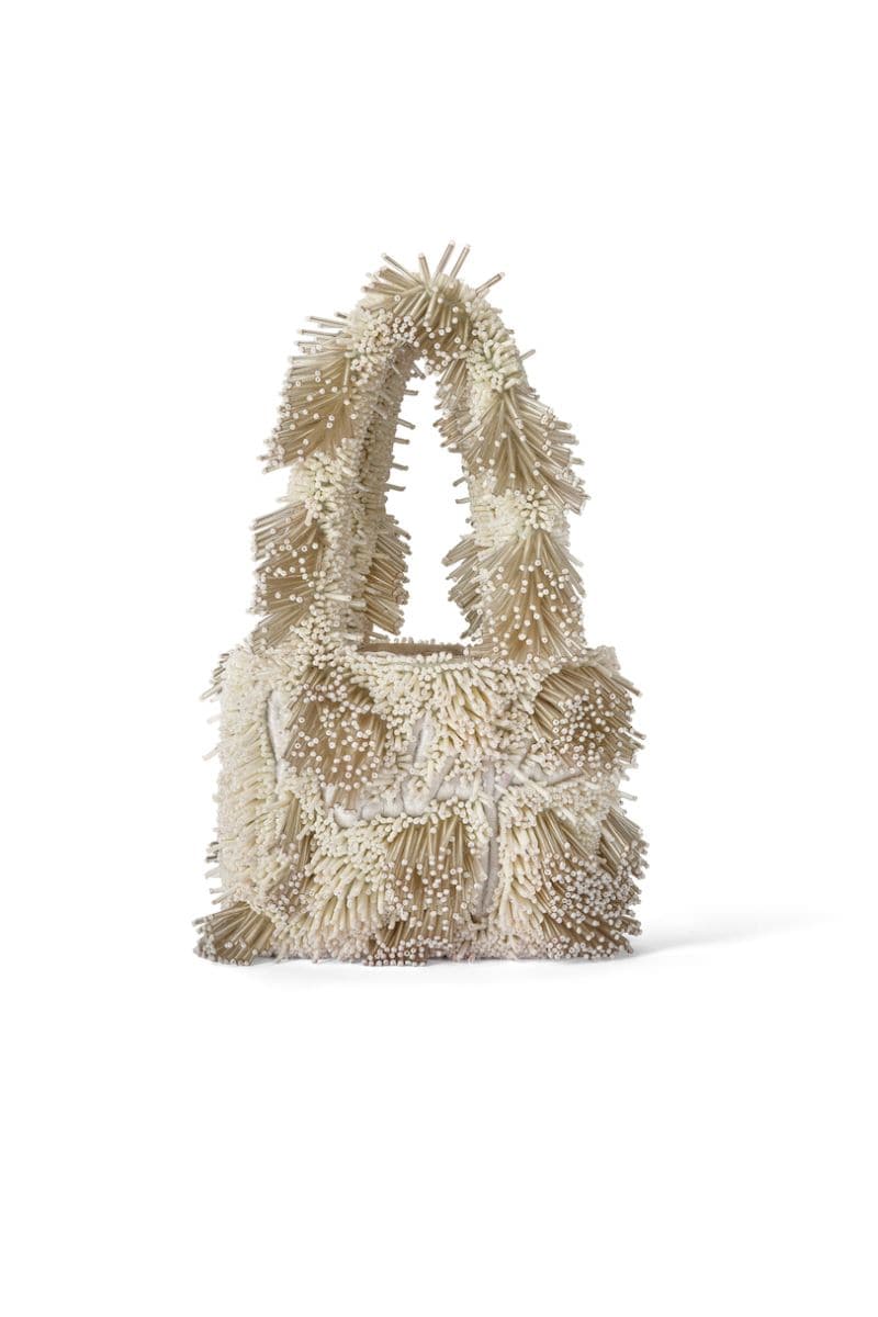 Onalaja ZAZA MINI white top handle bag with sleek design and compact size, featuring a structured shape and top handle.