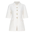 White short sleeve blazer by Valenciani, stylish jacket with tailored fit and classic design, displayed on a hanger.