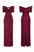 HACCHIC COUTURE Ruby Bow Midi Dress in wine red, featuring a fitted midi length with bow detail at the waist and elegant sleeveless design.