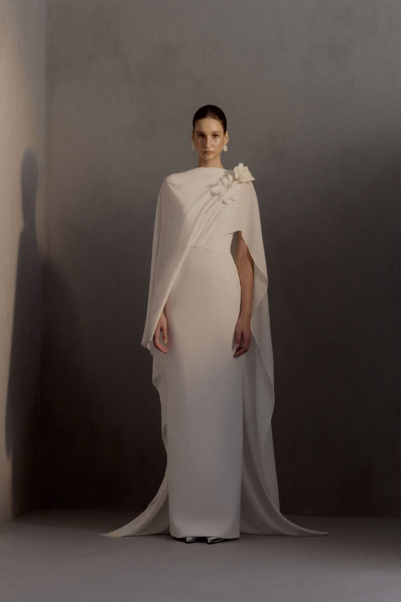White Plan Chariot Dress gown featuring elegant fabric and intricate design, perfect for formal occasions.