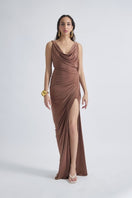 Deme by Gabriella CULT MIA X DEME maxi dress in flowy fabric with floral pattern and V-neck design, displayed on a hanger.