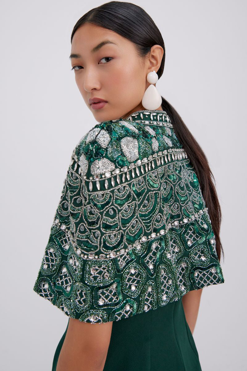 Elegant Beatrice gown by Raishma featuring flowing fabric and intricate detailing, shown on a model.