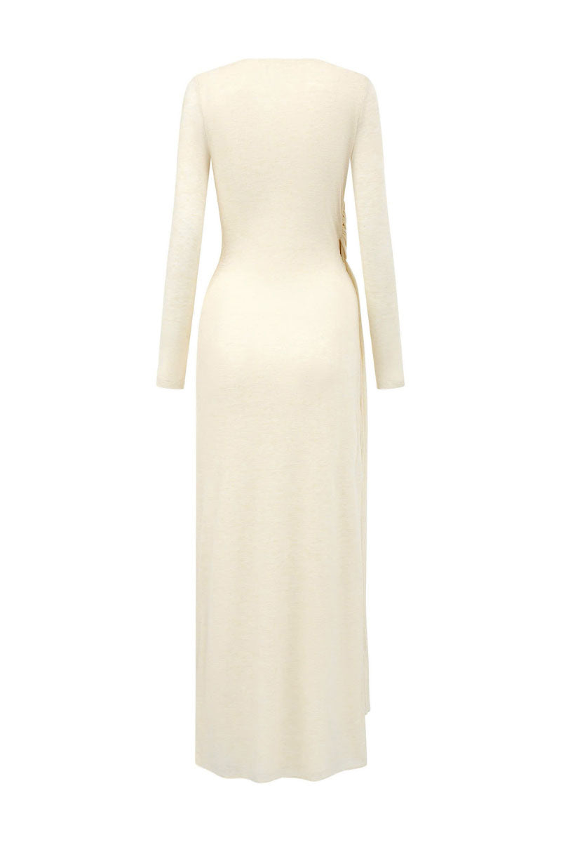 Golden maxi dress by Arti Apparel featuring a flowing design and elegant fabric, shown on a model.