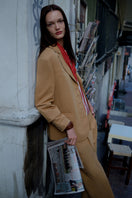Brown ColoReve blazer displayed on a mannequin, featuring a tailored fit and classic lapel design.