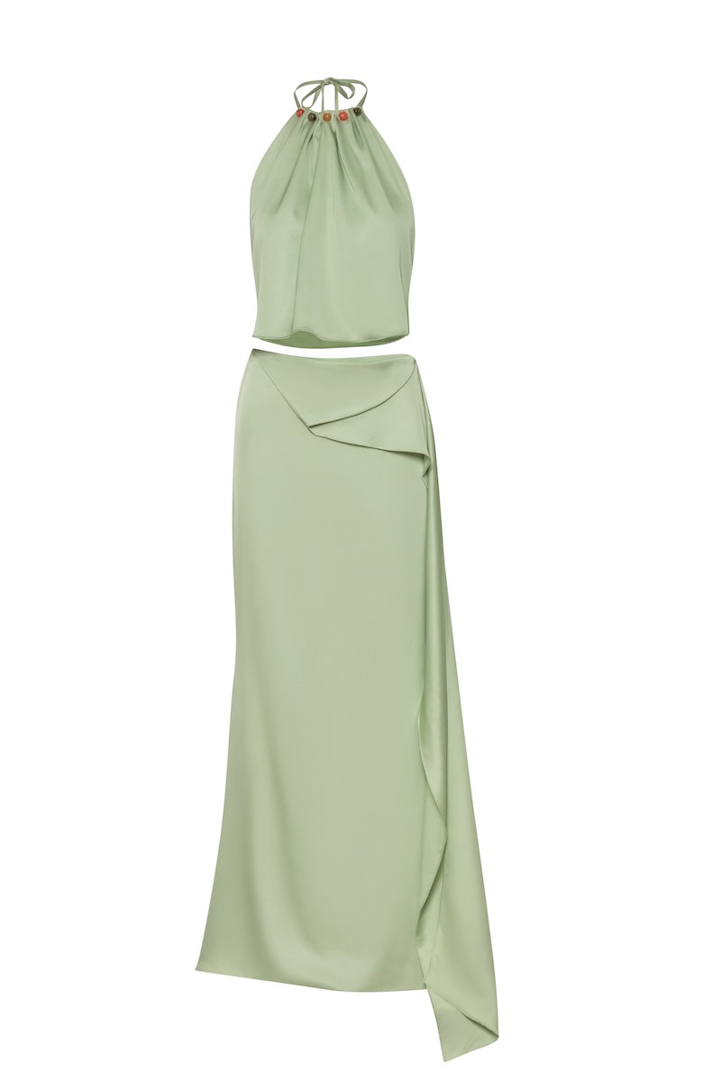 Baobab Lorena maxi skirt in flowing fabric with a vibrant pattern, shown on a hanger.