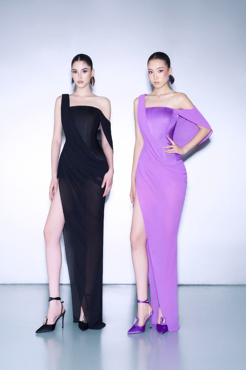 Black off-shoulder slit maxi dress by CEM, featuring flowing fabric and elegant design, perfect for formal or summer occasions.