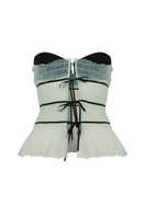 Sudi Etuz strapless tulle tie-front top in soft, sheer fabric with delicate ruffle details and a fitted silhouette.