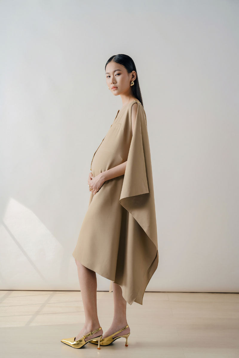 Beige sleeveless midi dress by DOC BAN featuring a sleek, elegant design with a fitted waist and flowing skirt.