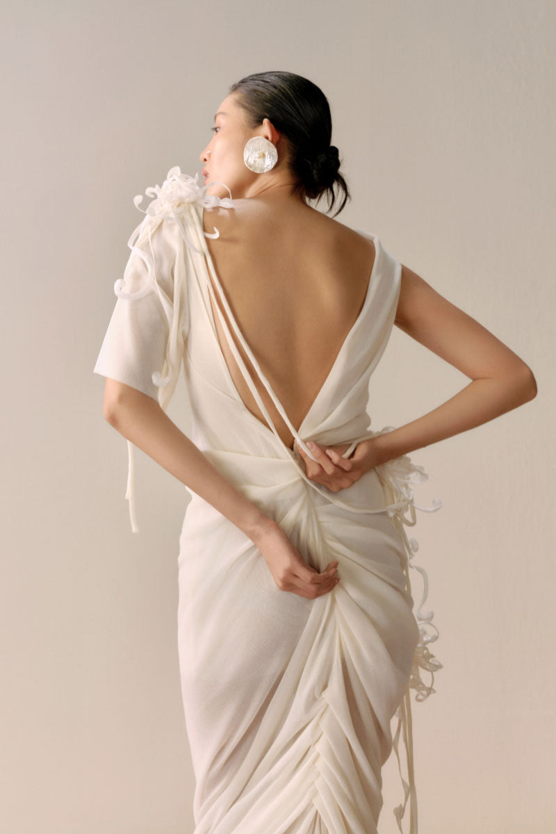 Lecia milky white backless sheer maxi dress with draped design, elegant and flowing for formal or evening wear.
