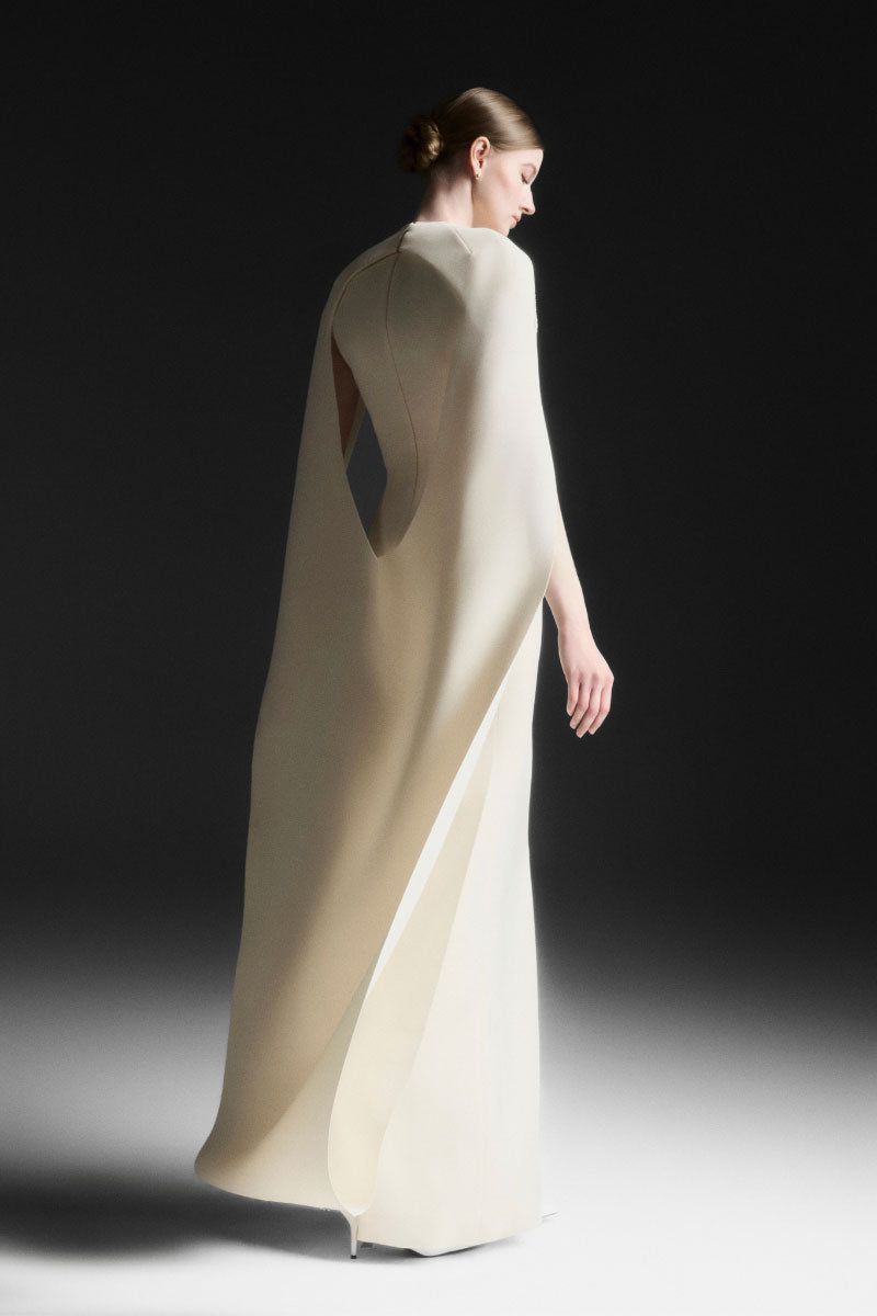 Maison Des Copains NYXELLE Cape Sleeve Floor Length Maxi Dress in Vanilla Cream, featuring elegant cape sleeves and flowing fabric.