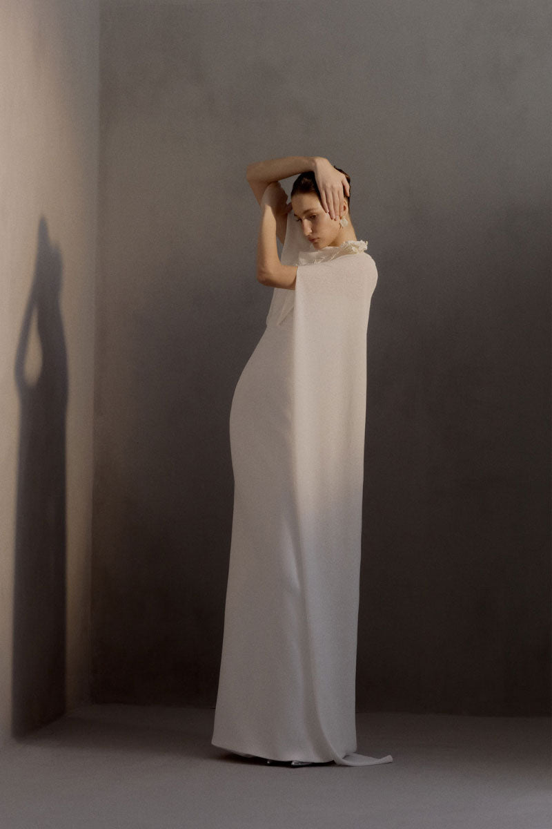 White Plan Chariot Dress gown with elegant flowing fabric and intricate design, displayed on a mannequin.