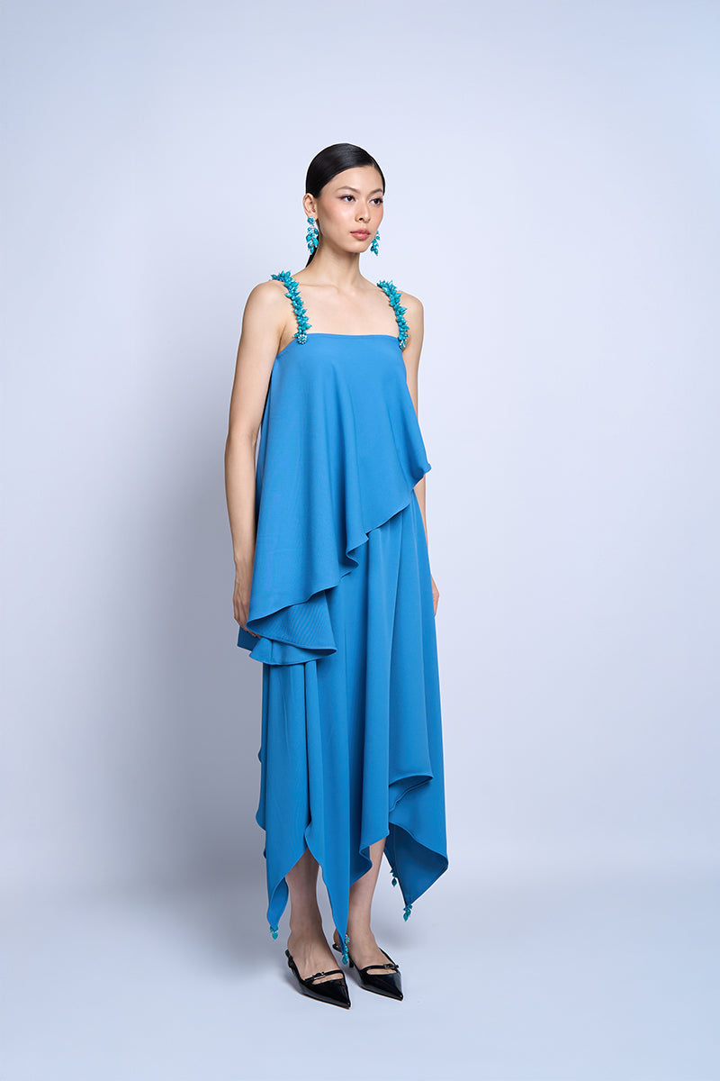Aidan & Ice Flora Blue Top, stylish women's blouse with floral pattern, short sleeves, and relaxed fit, displayed on a hanger.