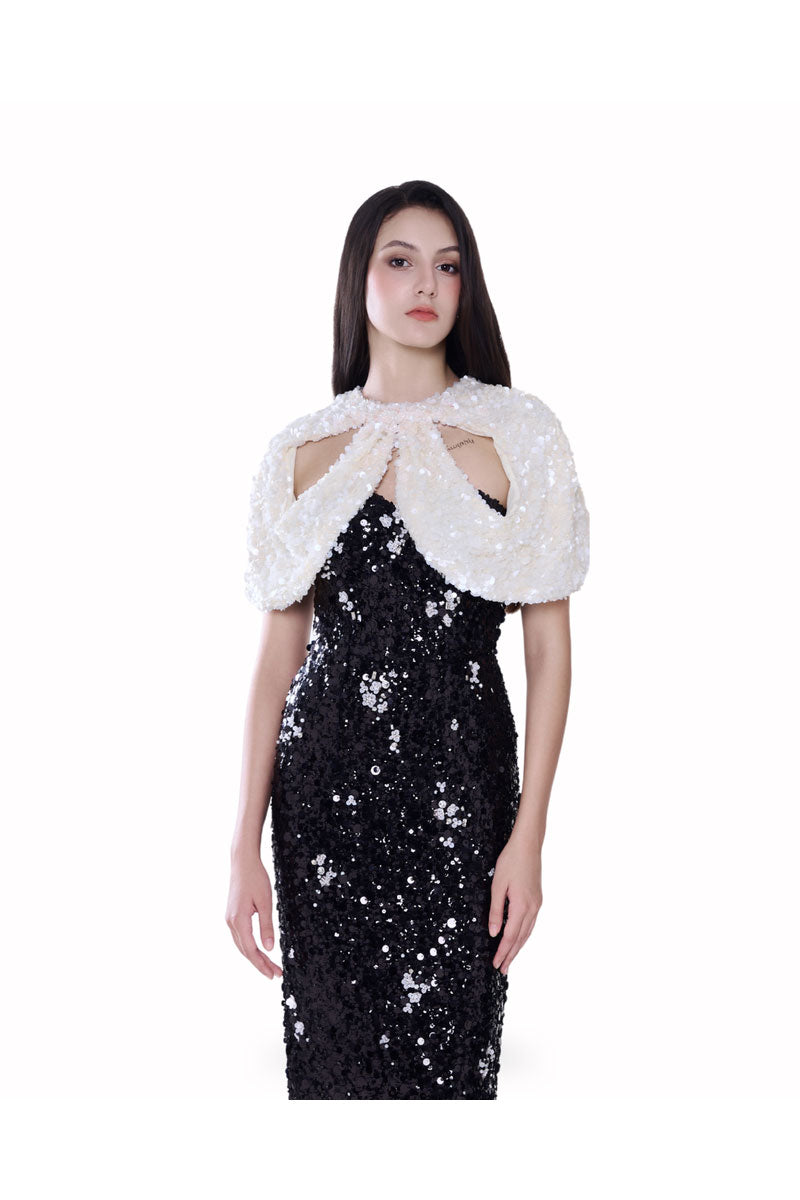 Black Luna cape gown by HACCHIC COUTURE, elegant maxi dress with flowing fabric and cape detail, perfect for formal occasions.