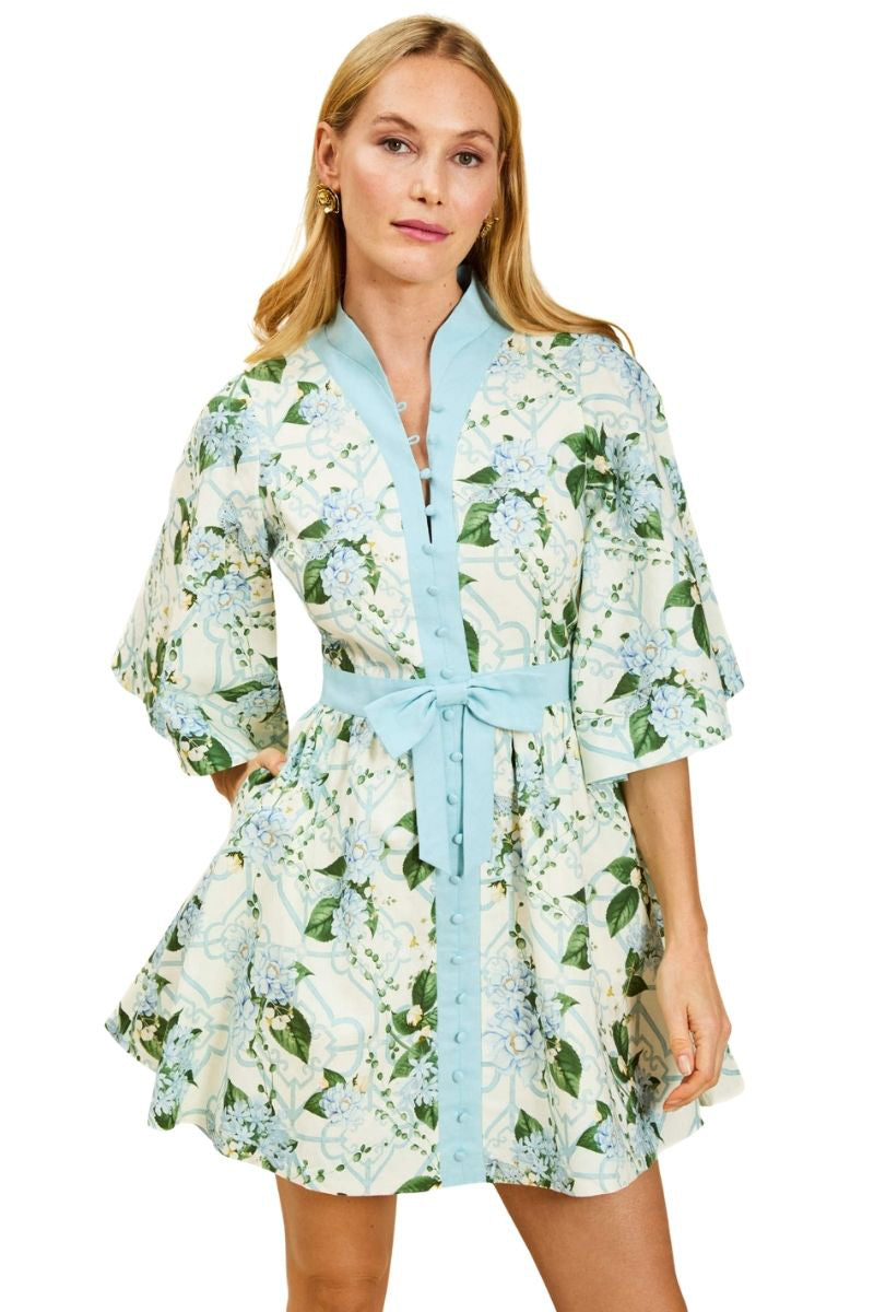Mestiza New York Carmen mini dress in Quatrefoil Garden print, featuring a fitted silhouette and vibrant floral pattern.