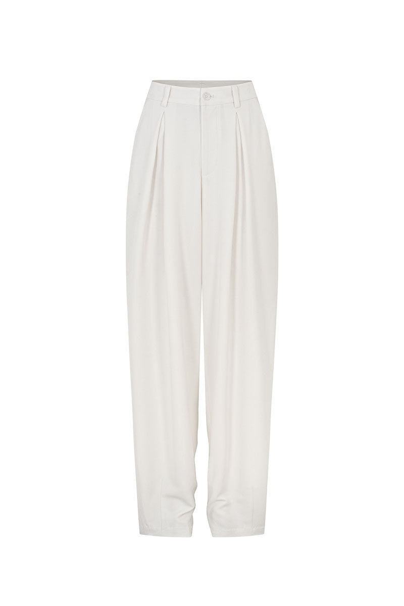 White tapered leg trousers by Valenciani, featuring a sleek fit and smooth fabric, displayed on a mannequin.