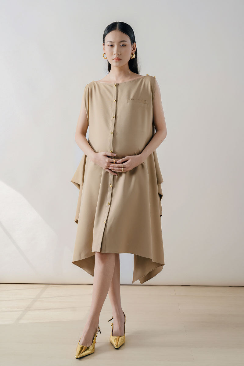 Beige sleeveless midi dress by DOC BAN, featuring a flowy silhouette and elegant design, perfect for casual or formal occasions.