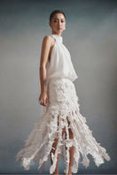 White Plan Flora halter midi dress featuring a flowy fabric and floral print, sleeveless design with a halter neckline.