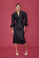 Sudi Etuz raw denim midi skirt with a high waist and classic five-pocket design, shown on a neutral background.