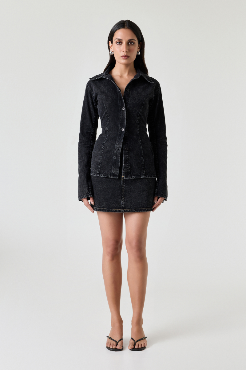 Dark denim Dalia top by Summer Away, casual shirt with button-up front and long sleeves, displayed on a hanger.