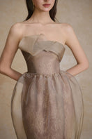 Elegant flux gown by Arti Apparel featuring flowing fabric and intricate detailing, perfect for formal occasions.