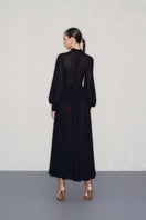Black midi dress by CEM with gold jeweled embellishments, featuring a fitted silhouette and elegant design.
