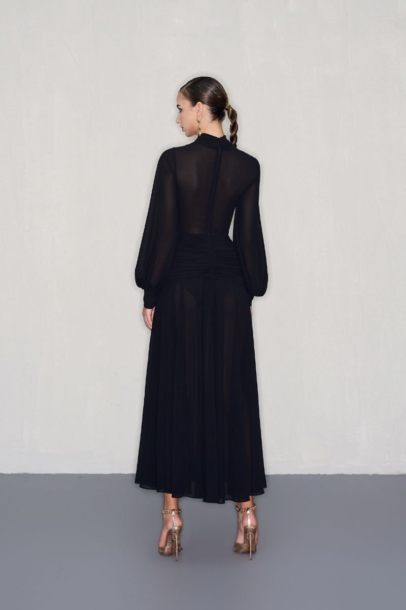 Black midi dress by CEM with gold jeweled embellishments, featuring a fitted silhouette and elegant design.