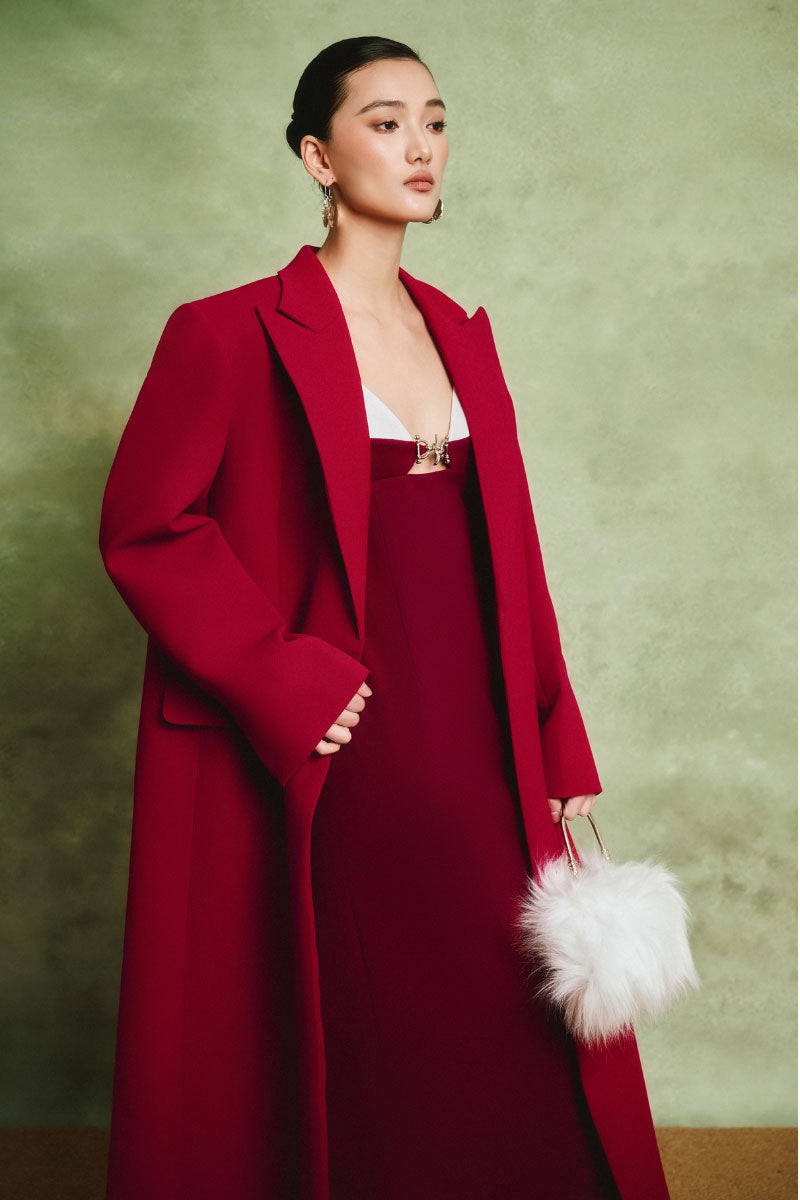White Plan Scarlet tailored coat displayed on a hanger, showcasing its sleek design and classic tailored fit.