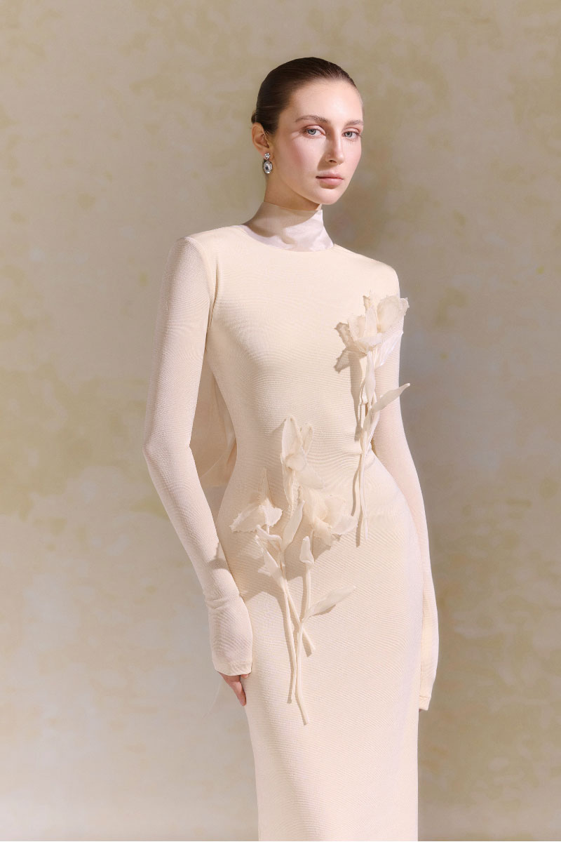 Arti Apparel Doha Dress, stylish midi dress with a flowing design, displayed on a mannequin.