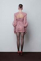 Do Long Midnight Polaroid mini dress, stylish short dress with a sleek design, displayed on a hanger against a plain background.