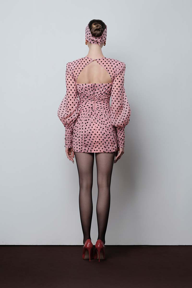 Do Long Midnight Polaroid mini dress, stylish short dress with a sleek design, displayed on a hanger against a plain background.
