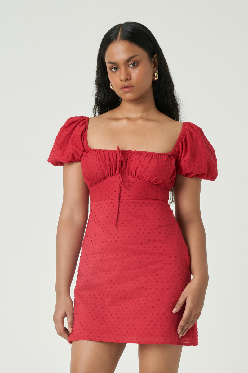 Summer Away Dominica mini dress in cherry featuring a vibrant red fabric and a stylish, fitted silhouette.
