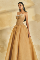 Off-shoulder chiffon and mesh gown by L'SCARLETT, featuring flowing fabric and elegant design for formal occasions.