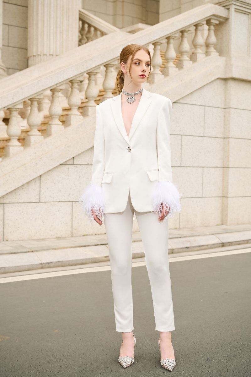 White Kelly Taffeta feather suit co-ords by 21Six featuring a tailored jacket and matching pants with feather details.