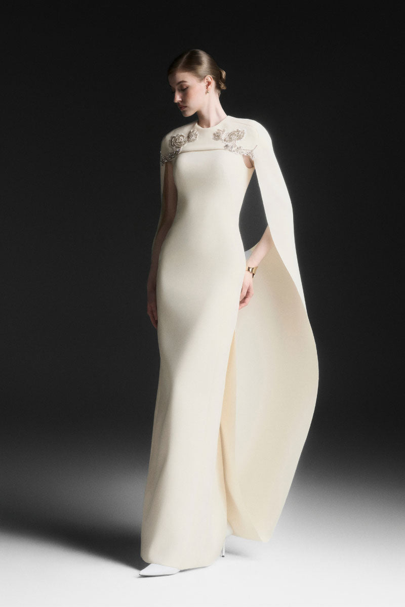 Maison Des Copains NYXELLE cape sleeve floor-length gown in vanilla cream, elegant dress with flowing fabric and cape-style sleeves