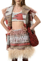 Lalo Avril knitwear vest in red and gold with a textured pattern, featuring a stylish, cozy design.